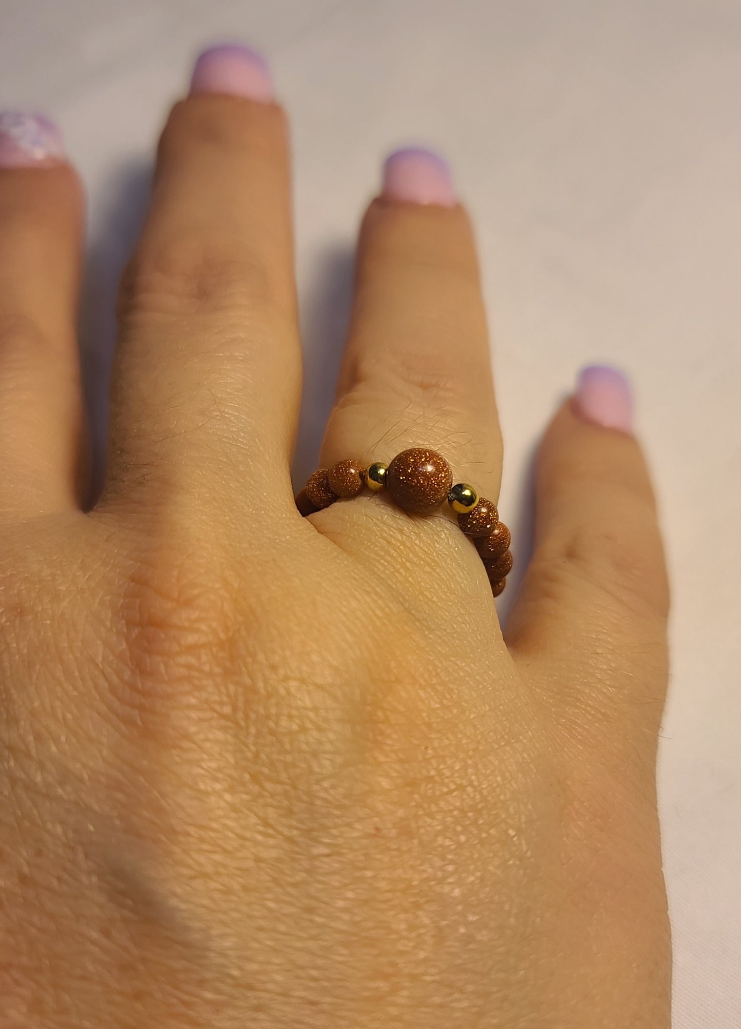Sparkling Sandstone Stretch Band Ring with Stainless Steel Gold Accents Adjustable Stretch 5–8