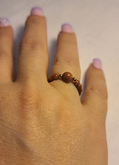 Sparkling Sandstone Stretch Band Ring with Stainless Steel Gold Accents Adjustable Stretch 5–8